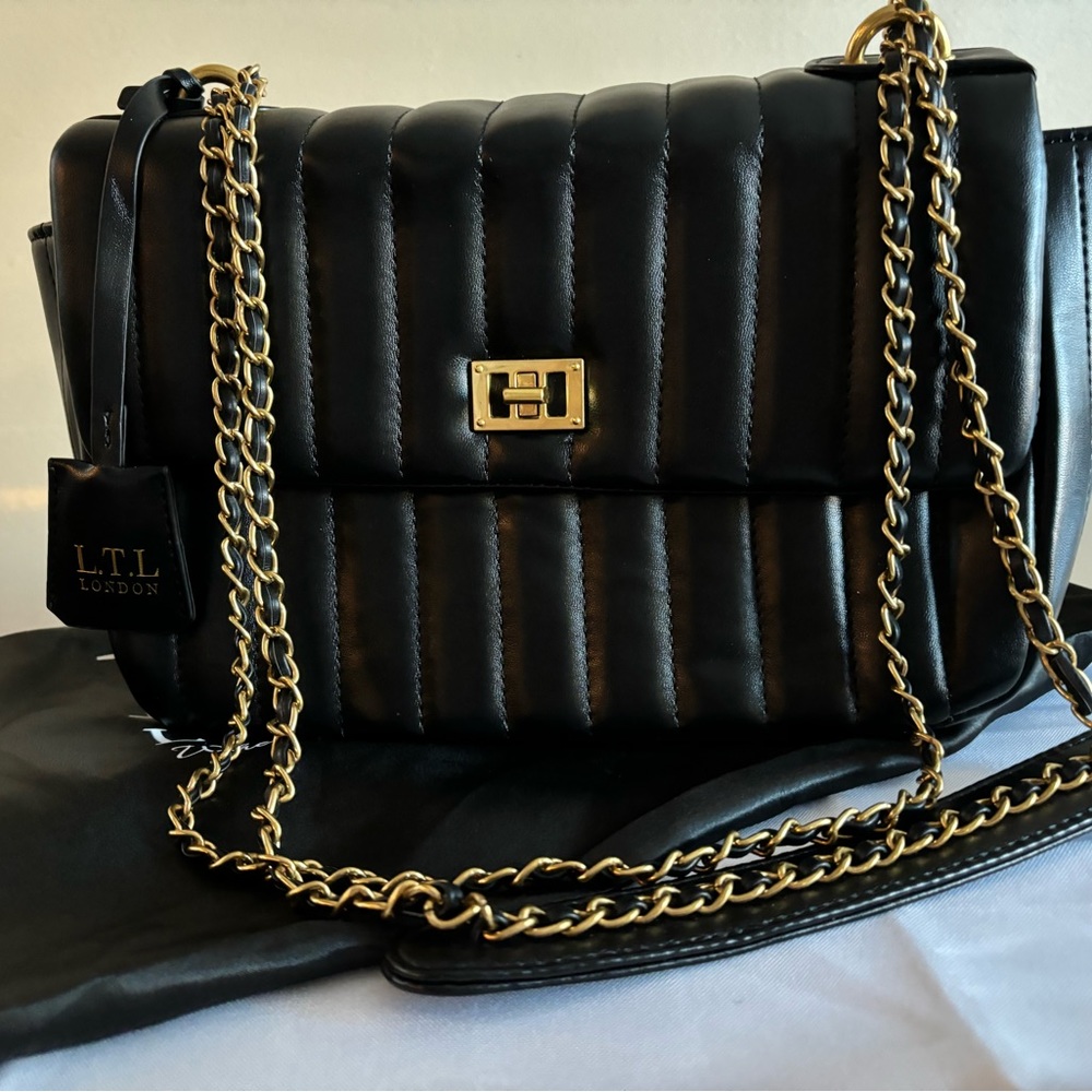 LTL black purse with dust bag. EUC. Like new